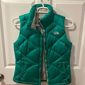 Green The North Face puffer vest.